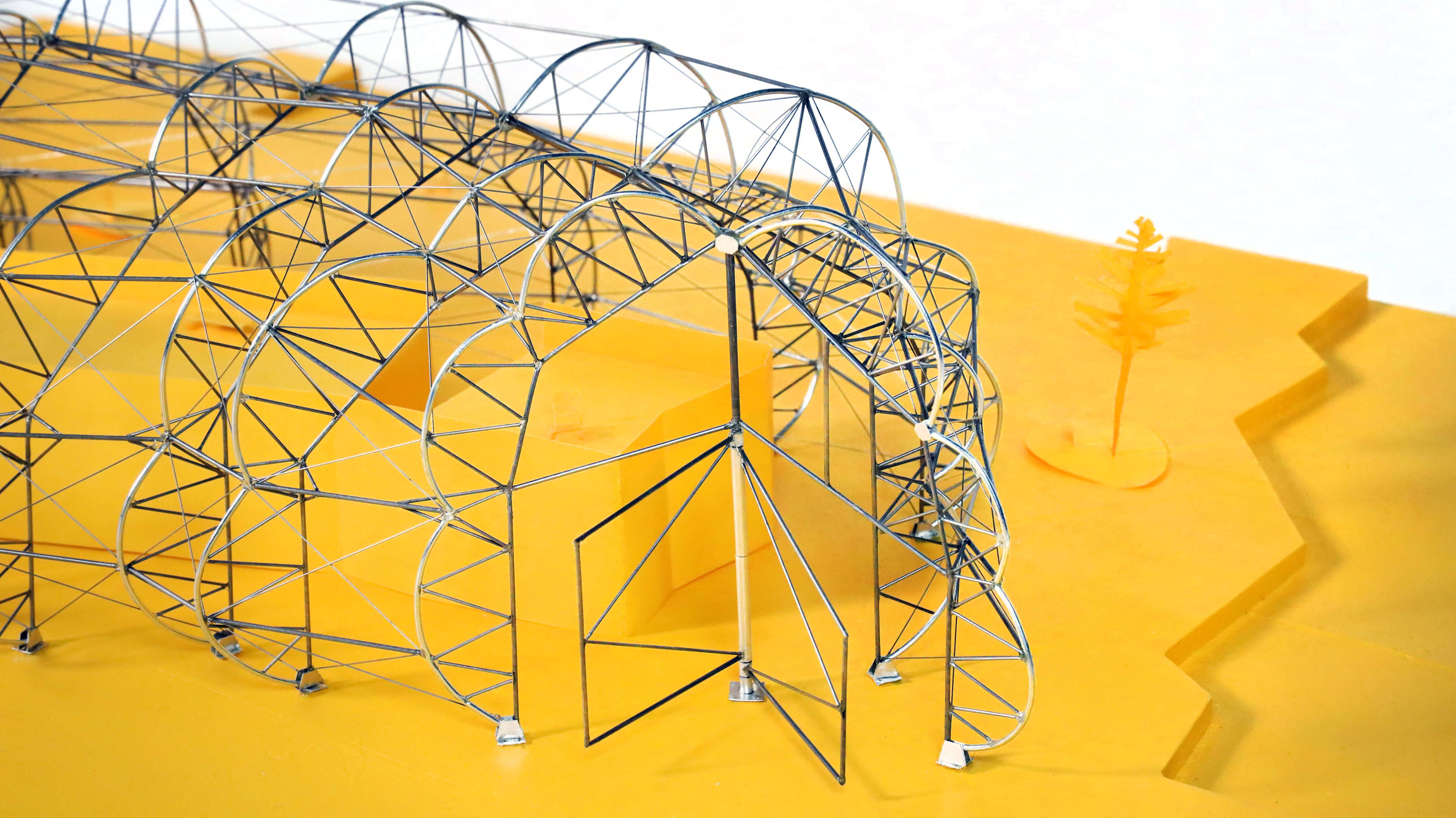 Close view of Design District Canteen's arched wire structural model