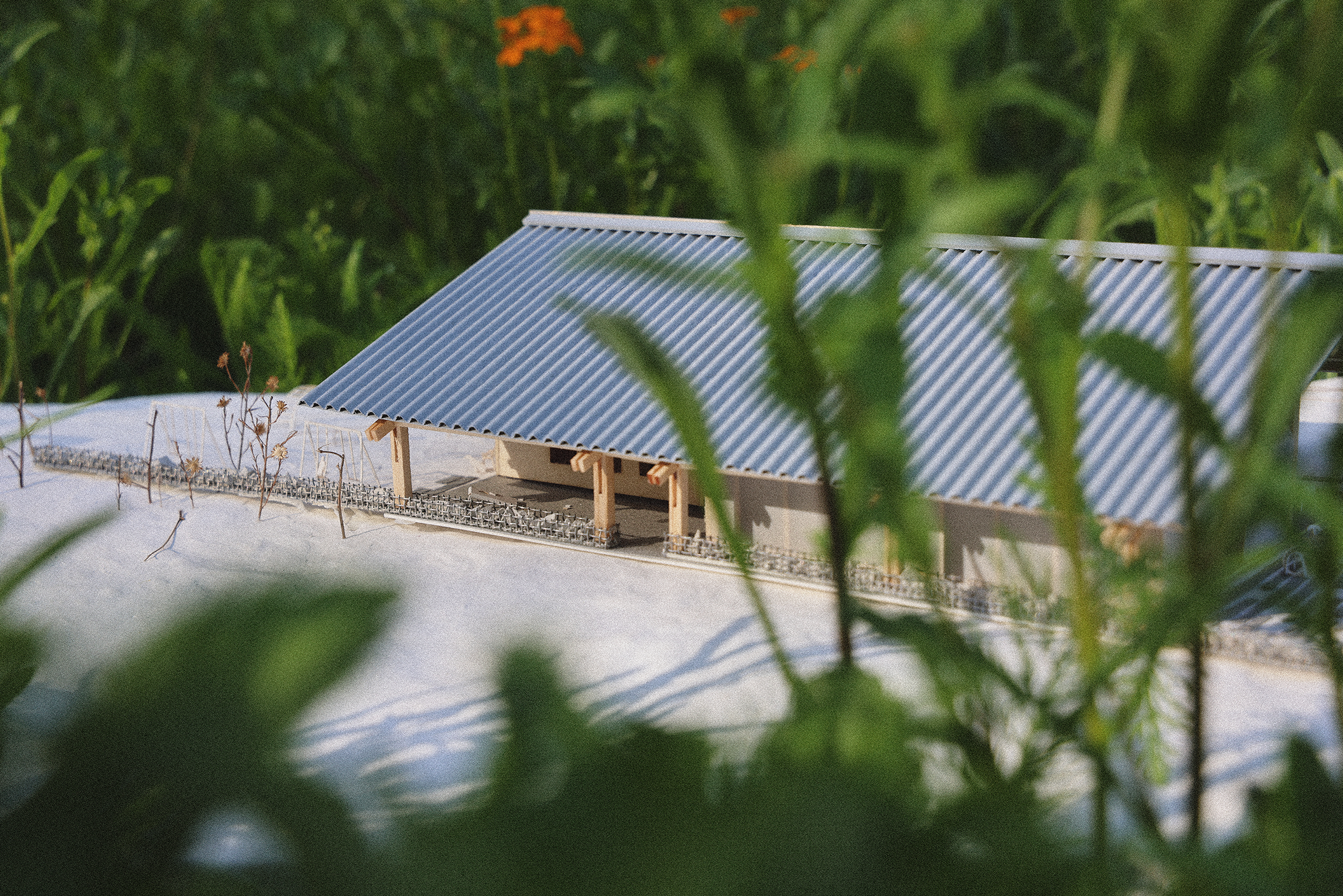 Physical model of Enfield Food Pantry seen through garden planting
