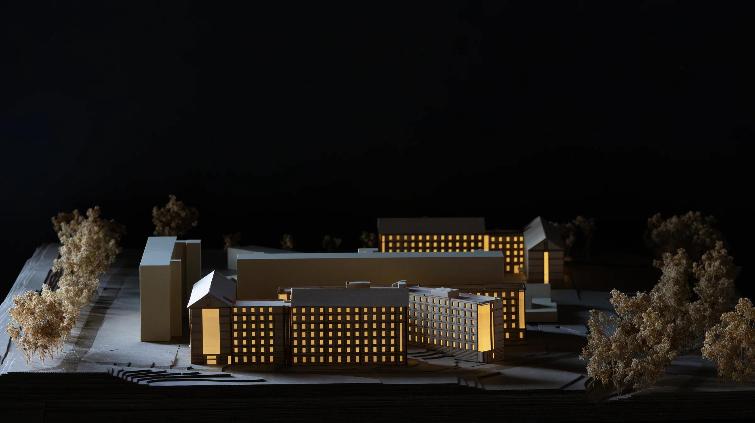 Illuminated physical model of the NC State Cates West Development photographed by Andrew Wheat