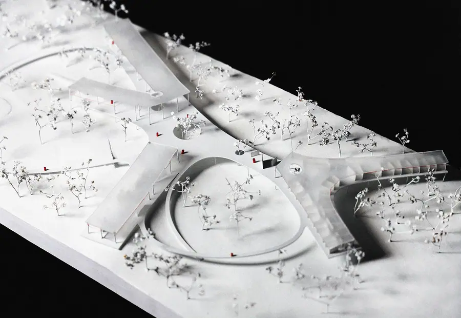 White physical site model of Borinquen Healing Center's curved processional landscape