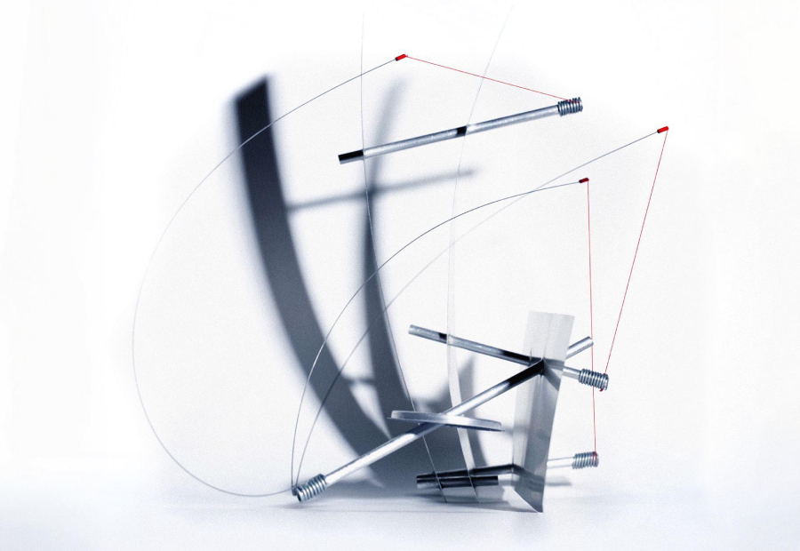 Kinetic chair model balancing metal rods, springs, cables, and planes
